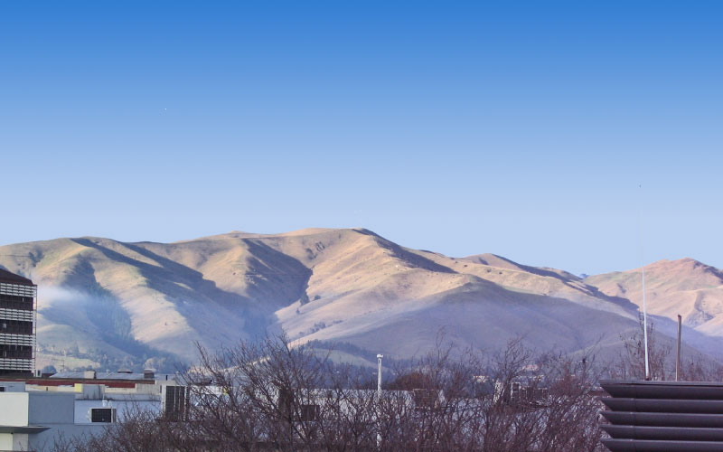 A clear winter day with air contaminants visibly trapped by an inversion layer over Blenheim. 