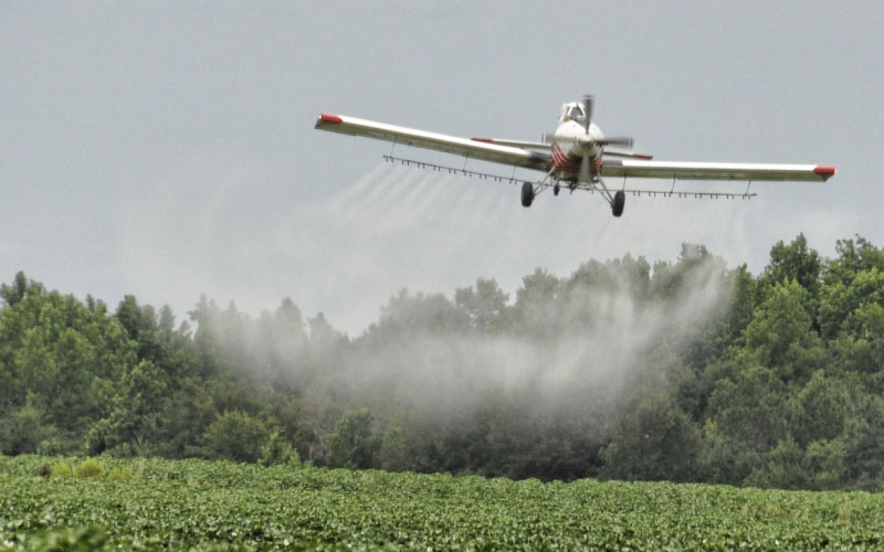 Plane spraying crops. 