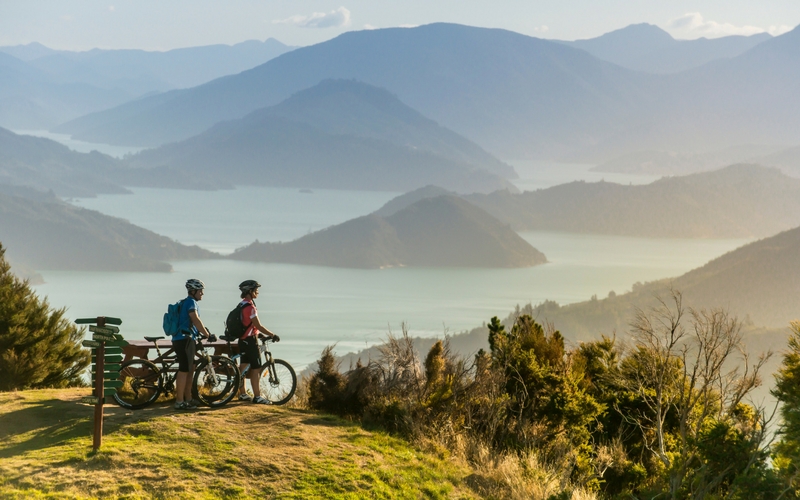 People biking and experiencing the Marlborough Sounds. 