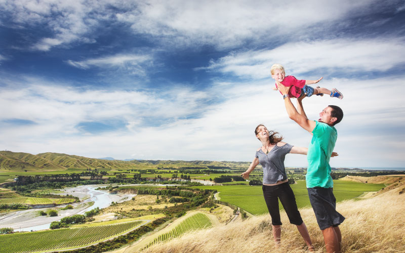 Family in Seddon at top of hill in wind. 